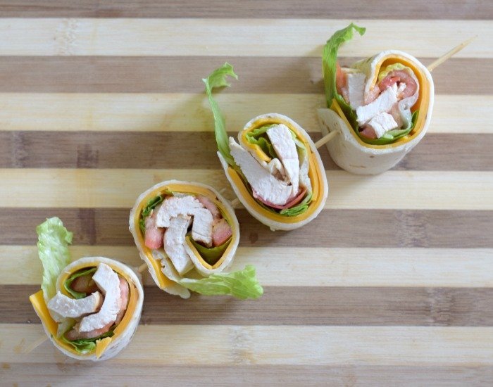 Create chicken taco wraps as pinwheels to serve for guests