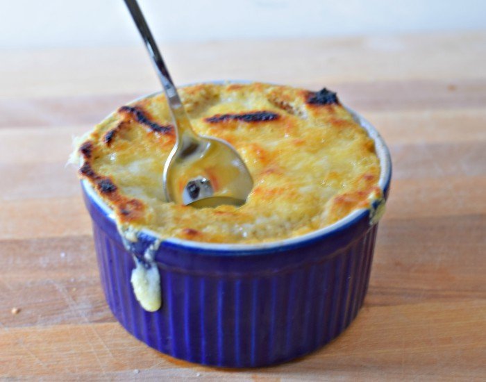 Break the crust of French onion soup