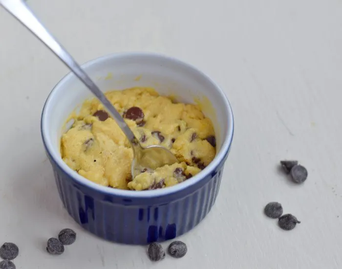 Spoon of individual microwave chocolate chip cookie