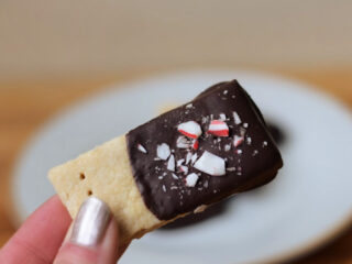 Holding peppermint chocolate dipped shortbread