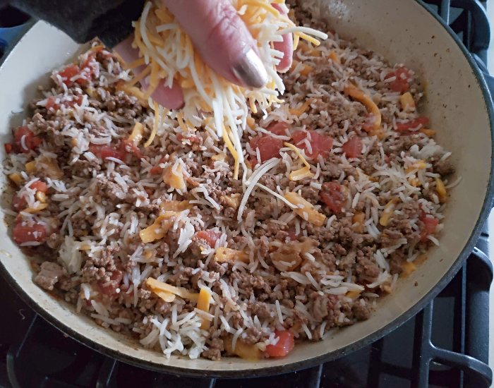 Add cheese to skillet