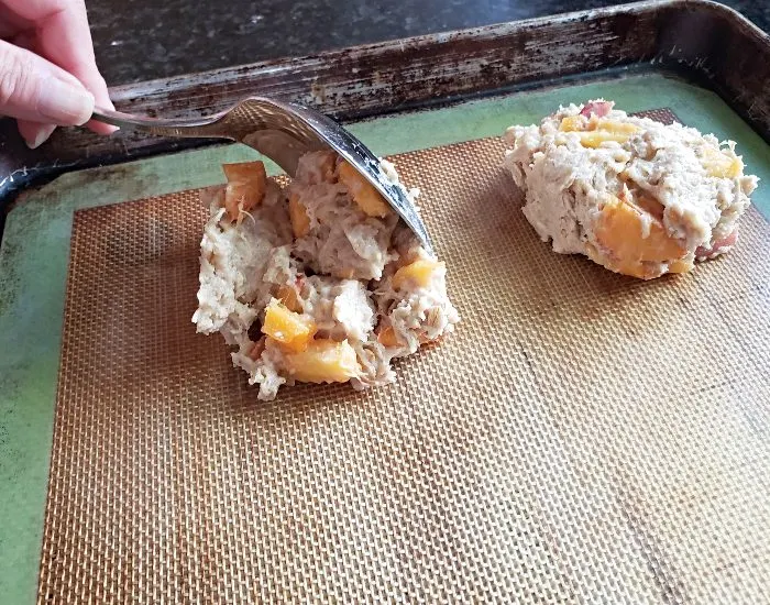 Scoop scones onto baking sheet