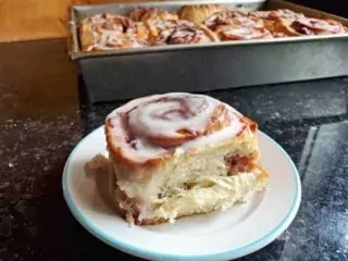 Plate with cherry cinnamon roll