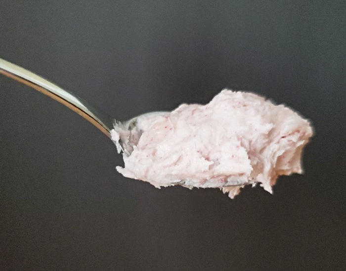 Spoon of pomegranate buttercream frosting