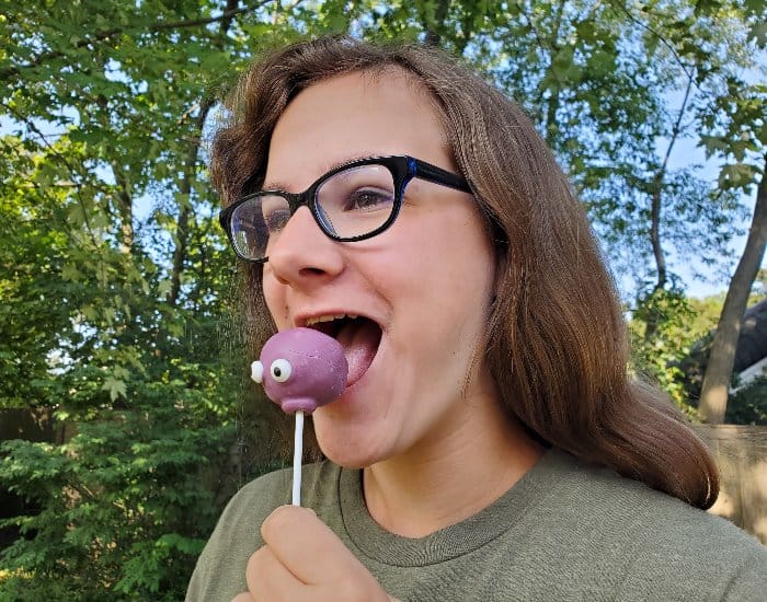 About to bite a monster cake pop