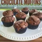 Bakery style chocolate muffins on a cake stand