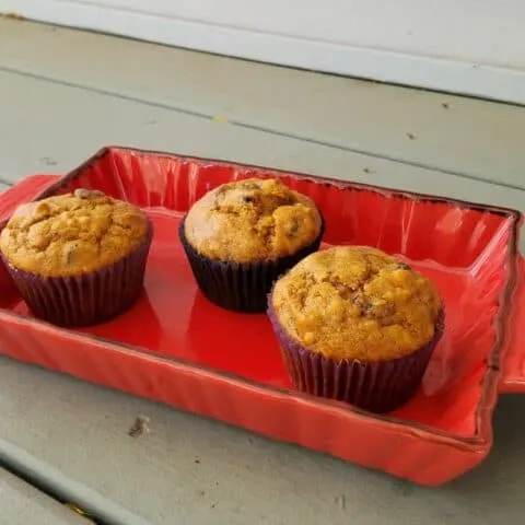three muffins in a red tray