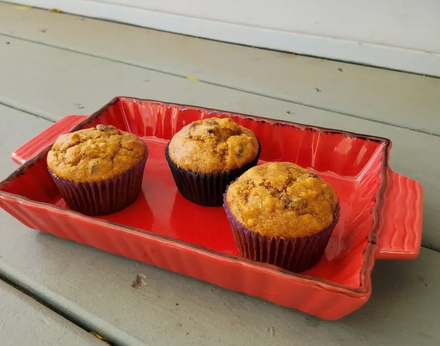 three muffins in a red tray