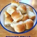 Bowl of yeast dinner rolls on wood background