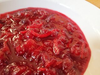 Closeup of a bowl of orange cranberry sauce