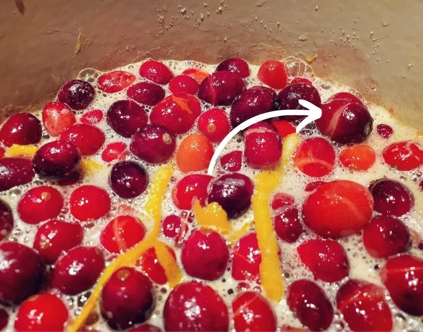 Cranberries that have popped their skin in a pot