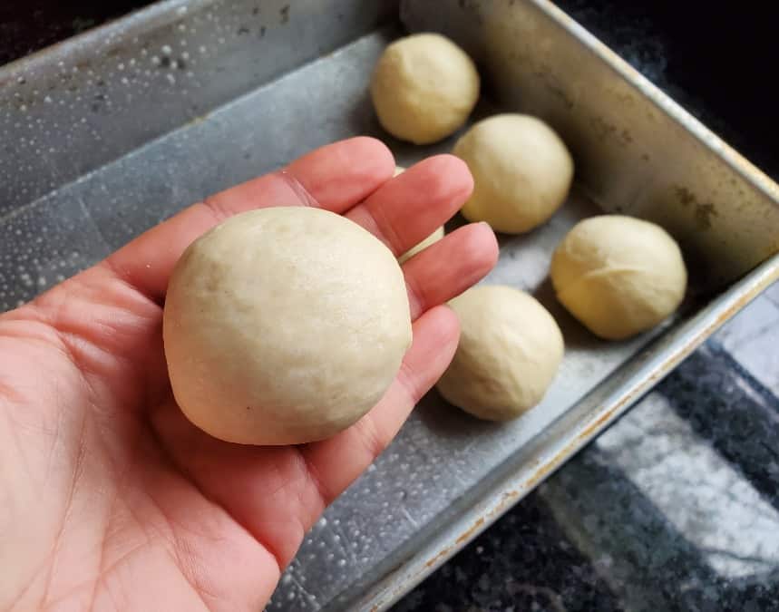 Dough rolled into smooth ball for pan of rolls