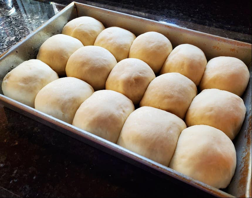 Pan of rolls risen and ready to bake