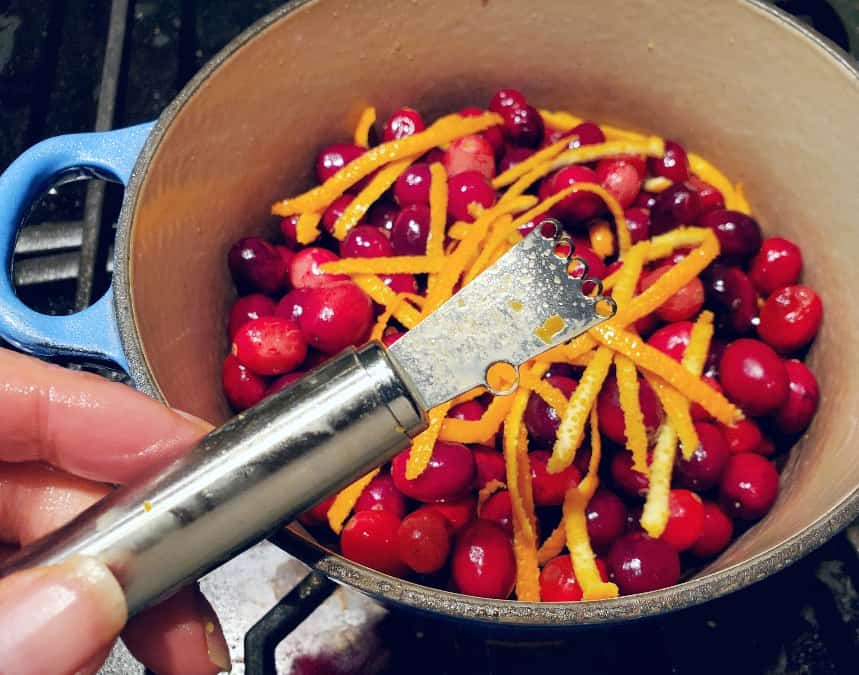 Rosle stainless steel zester over a pot of cranberries