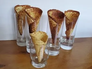 Waffle cones cooling sitting in glasses