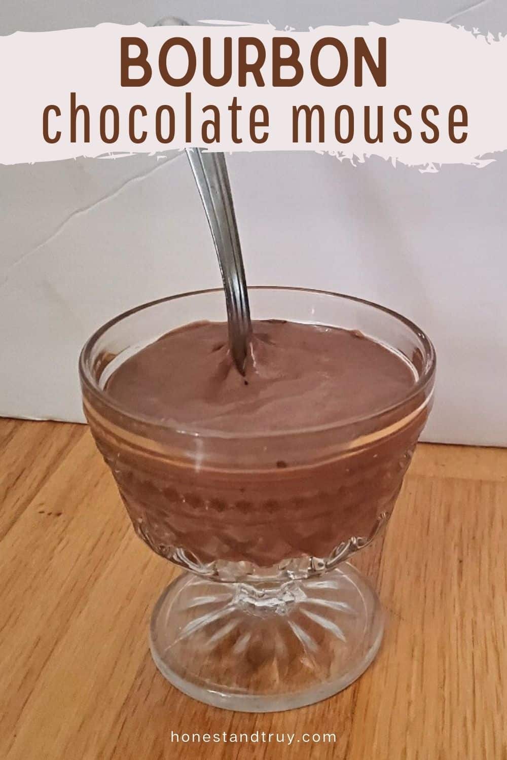 Bourbon chocolate mousse with a spoon in the dish.