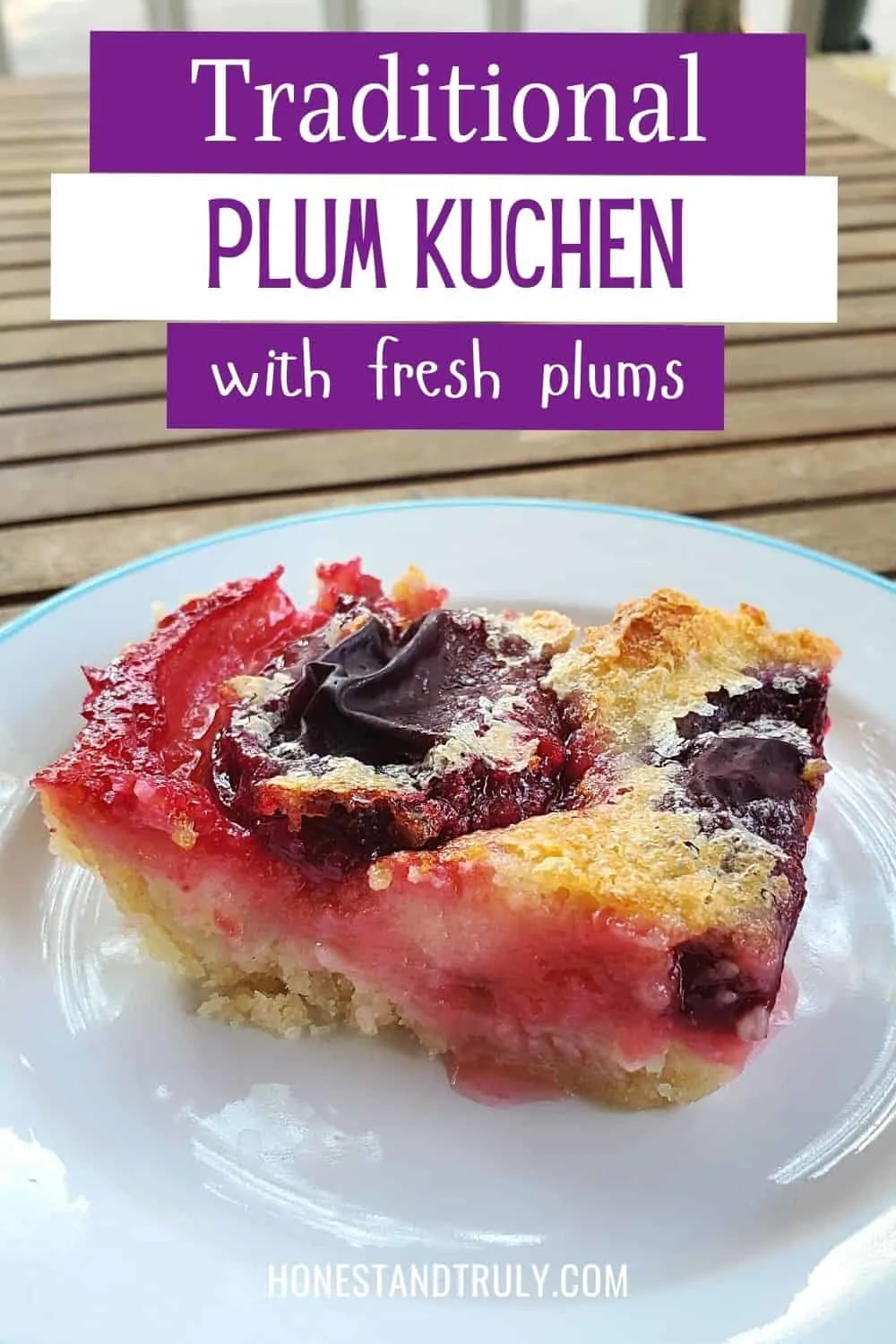 Side on shot of plum kuchen on a white plate with text tradtiional plum kuchen with fresh plums.