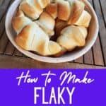 Basket of crescent rolls with text how to make flaky crescent rolls.