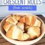 Bowl of homemade crescent rolls with text homemade crescent rolls from scratch.
