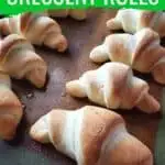 Crescent rolls on the baking tray with text copycat Pillsbury crescent rolls.