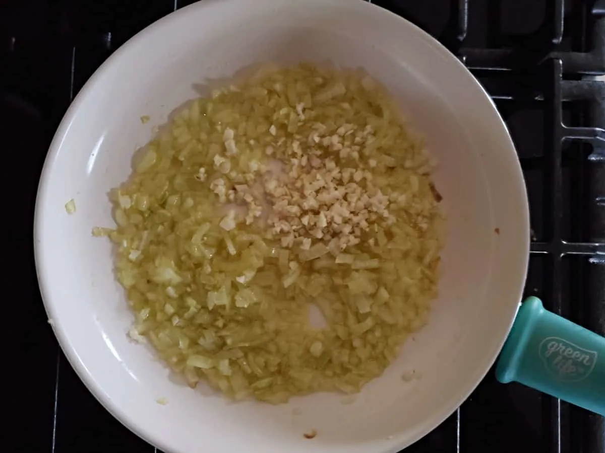 Sauteed onions with garlic in a pan.