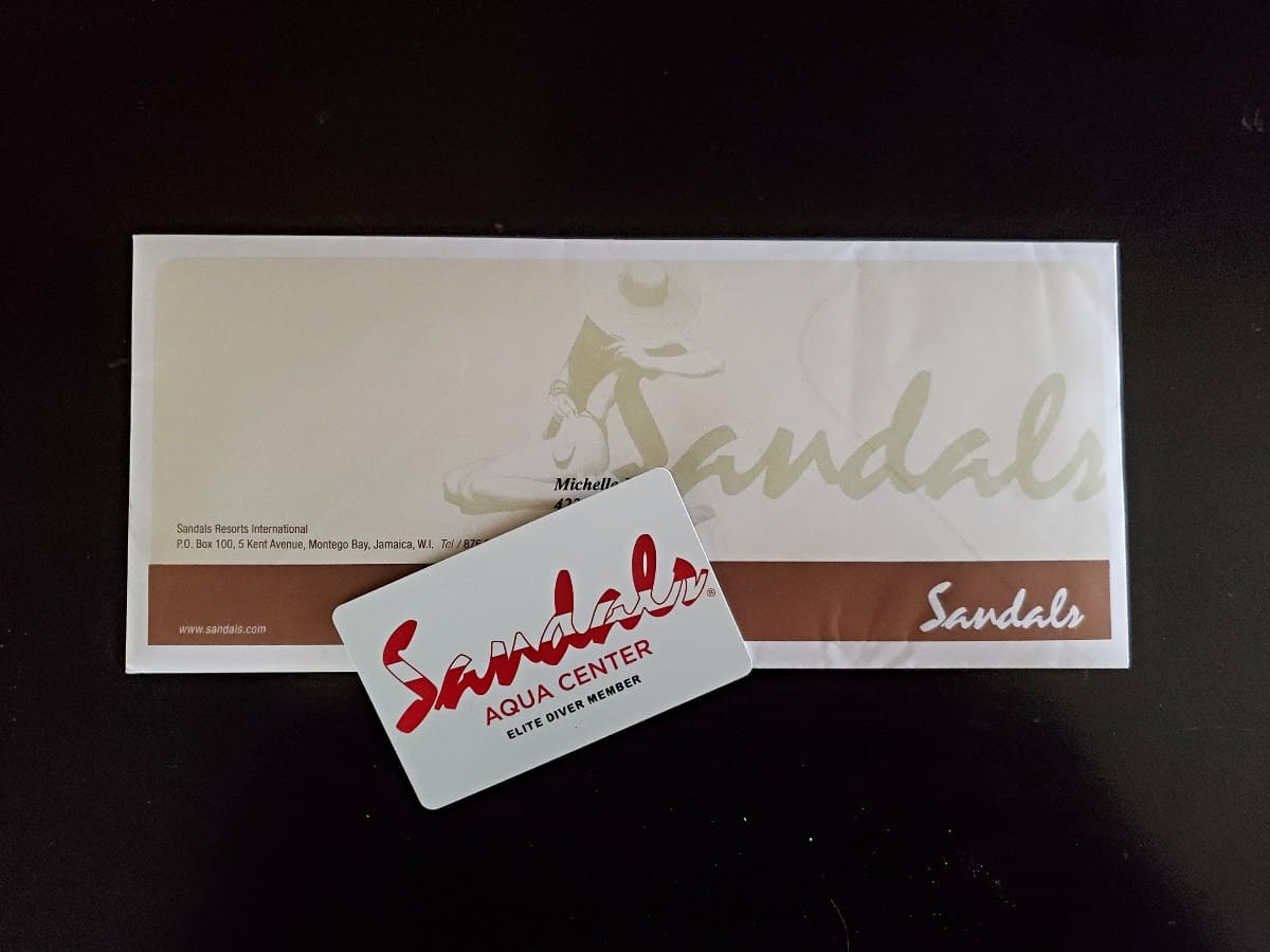 Sandals Elite Diver card with envelope behind it.