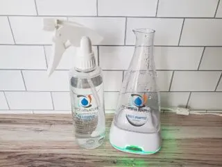 Force of Nature in spray bottle next to power station on a countertop.