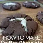 Chocolate cookies on a baking sheet with text how to make stuffed chocolate cookies.