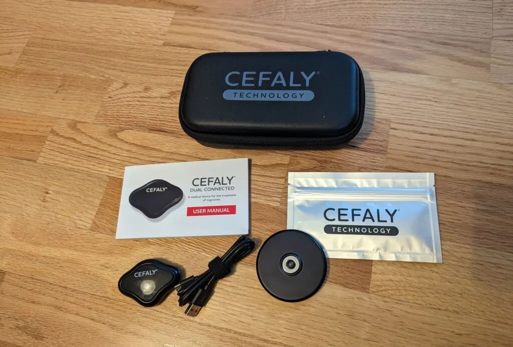 Image shows a CEFALY device bundle on a wood table.