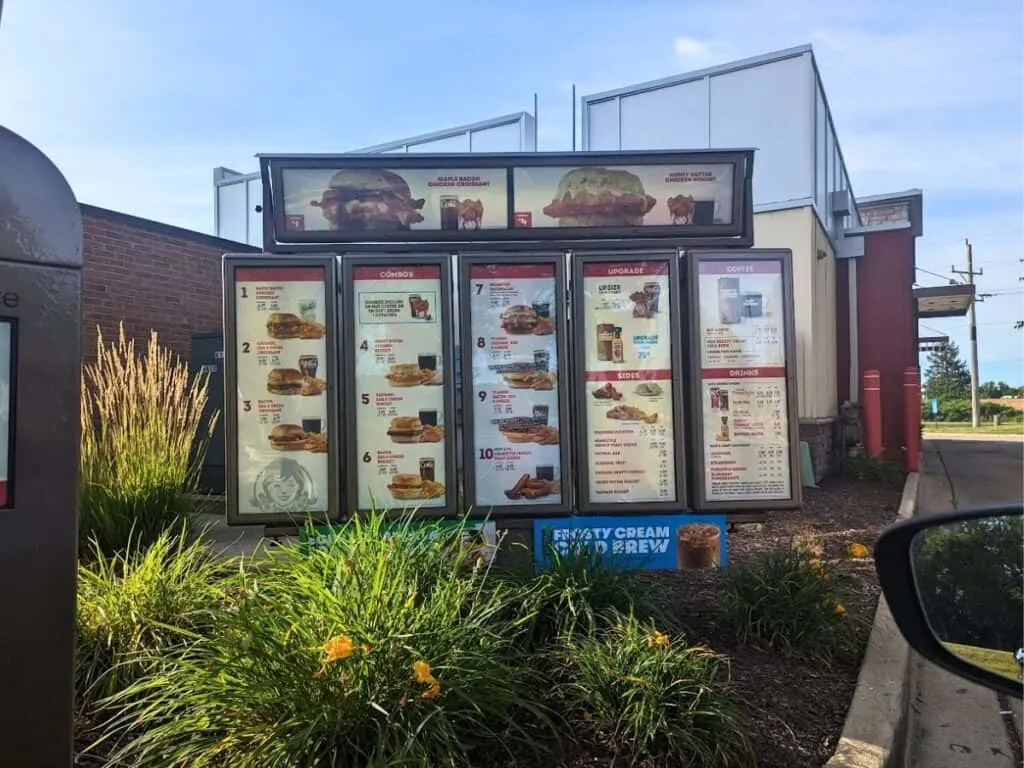 Image shows Wendys Breakfast Menu Sign from the drive through.