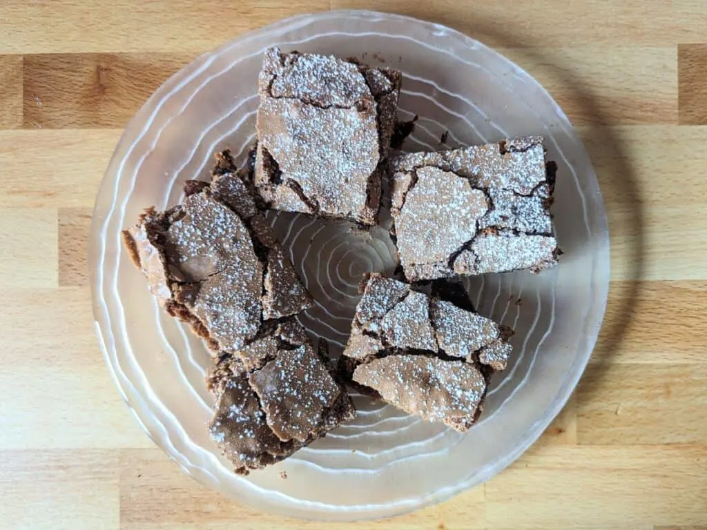 Image shows Overhead of brownies on a plate.