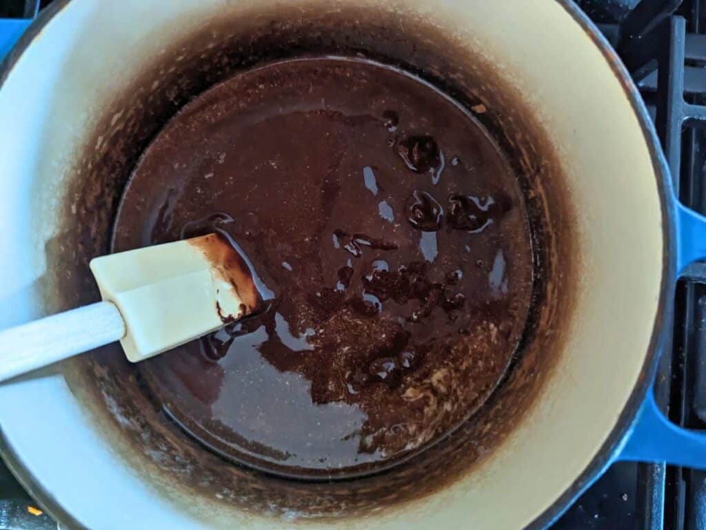 Image shows an Overhead of butter melted with chocolate.