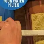 Image shows Loosening a filter with text step by step how to change your water filter.