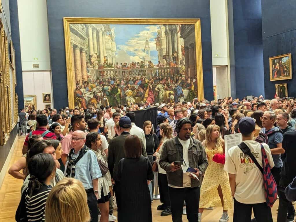 Image shows some of the Crowd waiting to see the Mona Lisa.