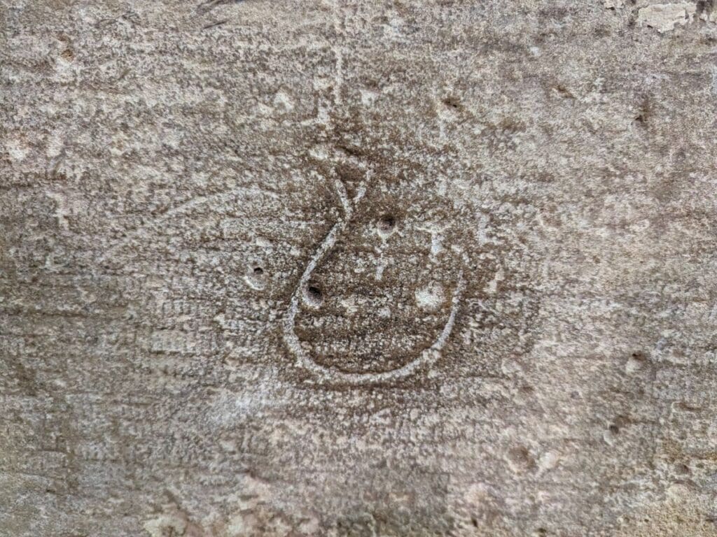 Image shows a makers mark on a stone at the Louvre.