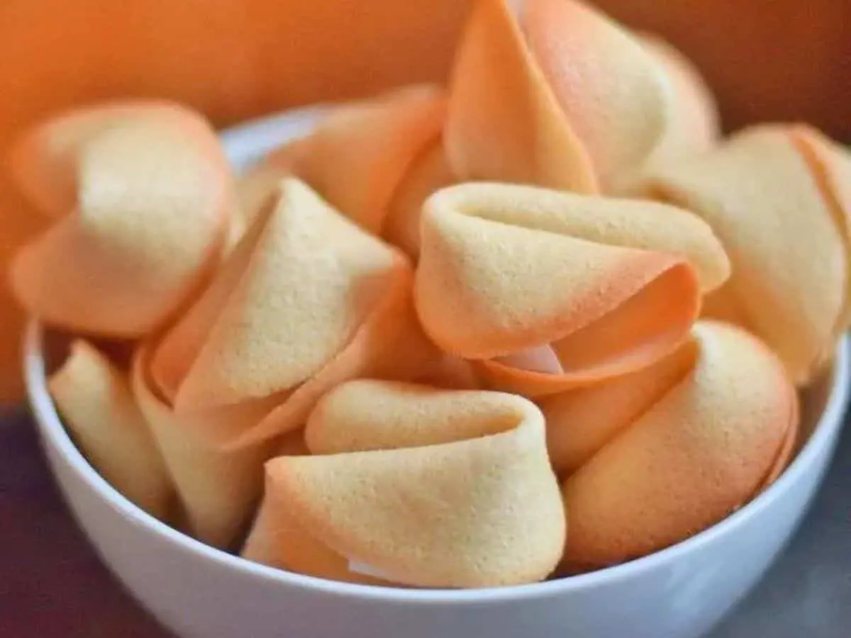 Image shows a Bowl filled with homemade fortune cookies.