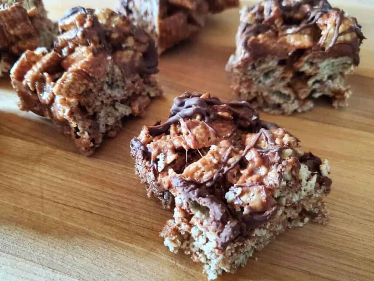 Overhead photo of a pan with double chocolate peppermint cereal bars with one pulled out from the main bunch.