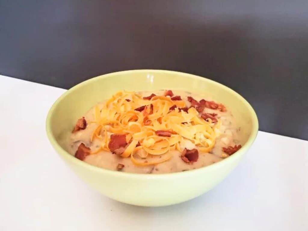 Image shows delicious instant pot potato soup in a bowl.