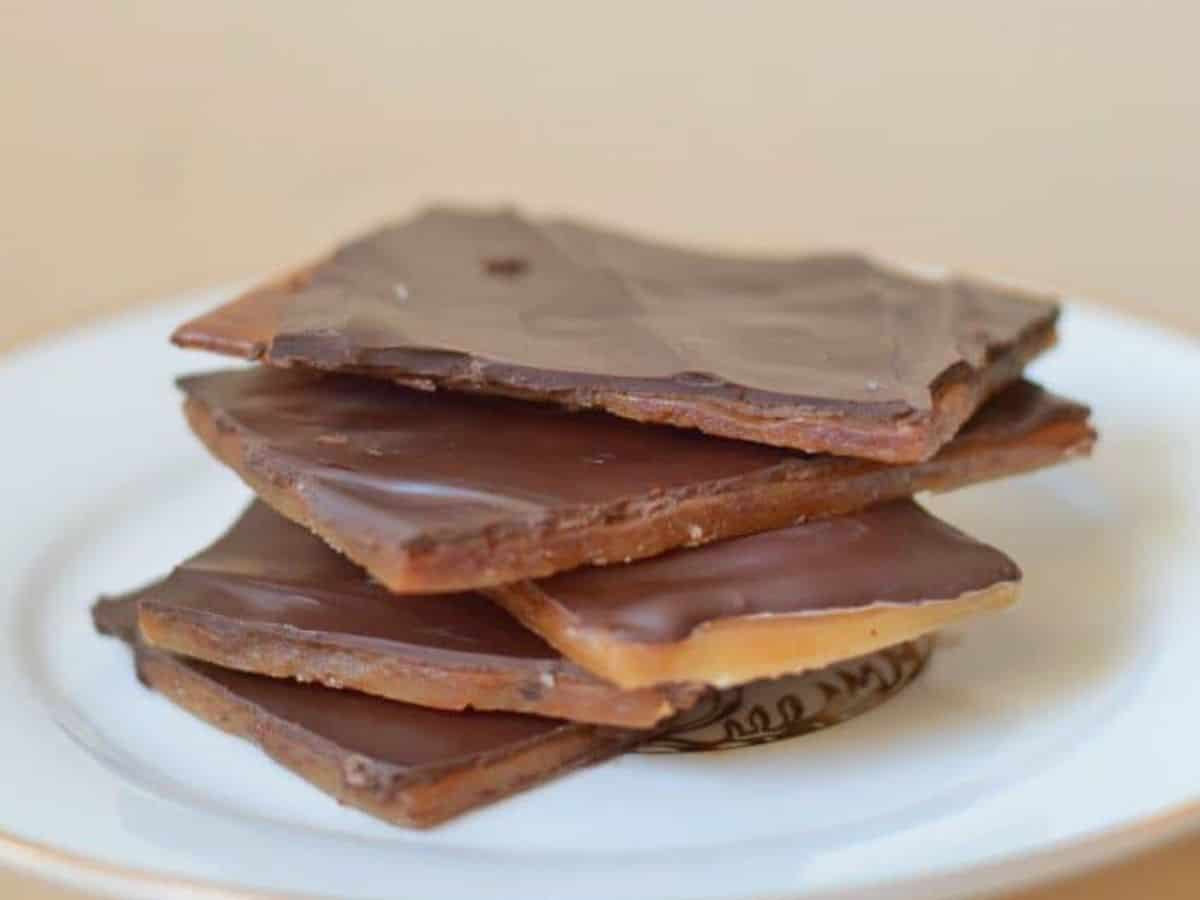 Image shows a stack of English Toffee on a white plate.