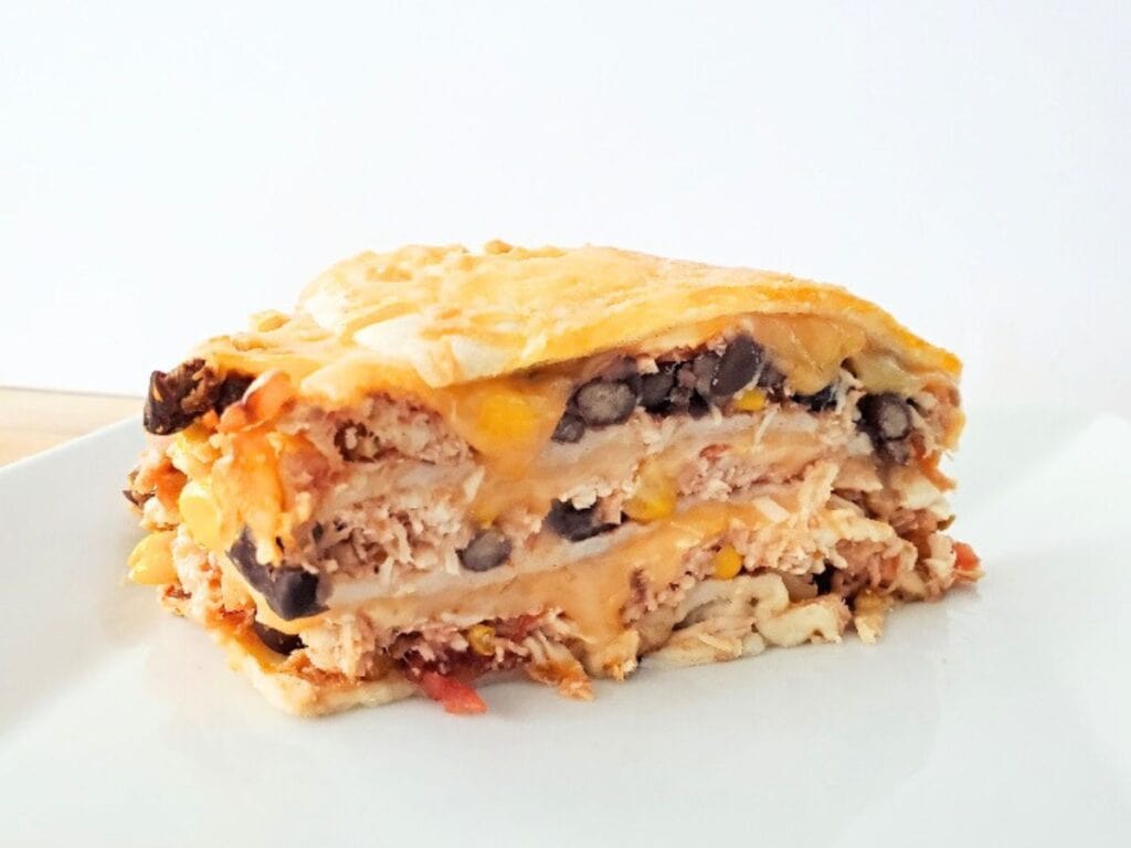 Image shows Southwest tortilla pie served on a plate.