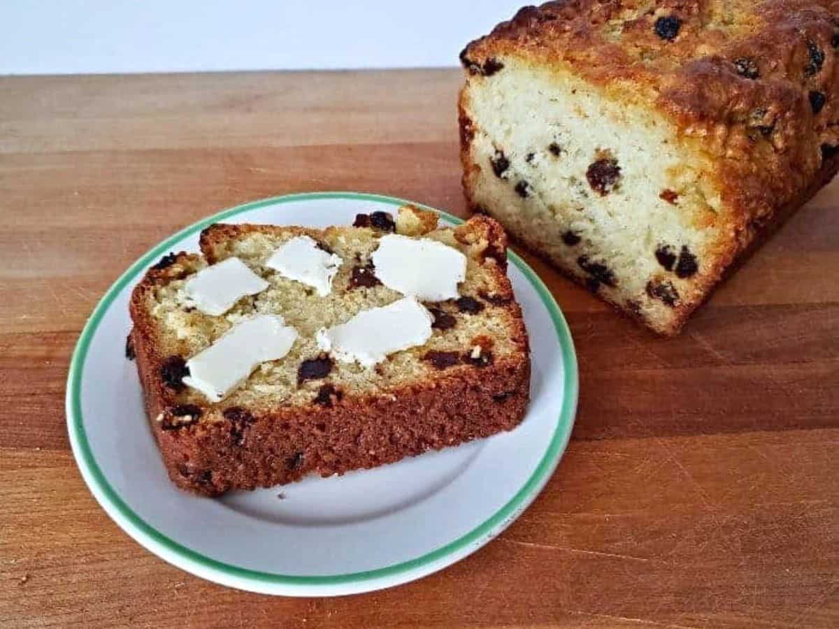 Overheard of a loaf of irish soda bread with slices cut.