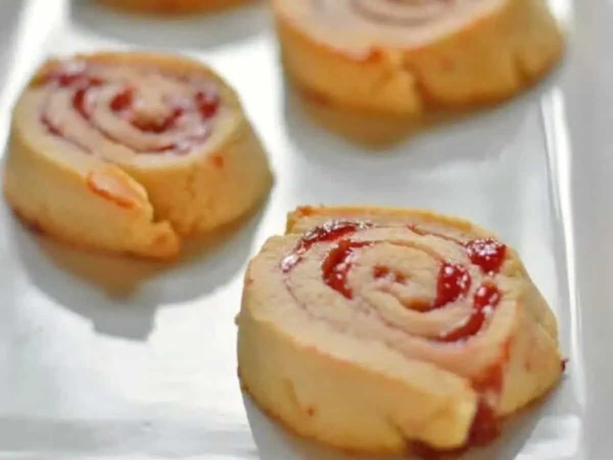 Image shows Cherry Pie Cookies close up on a white plate.