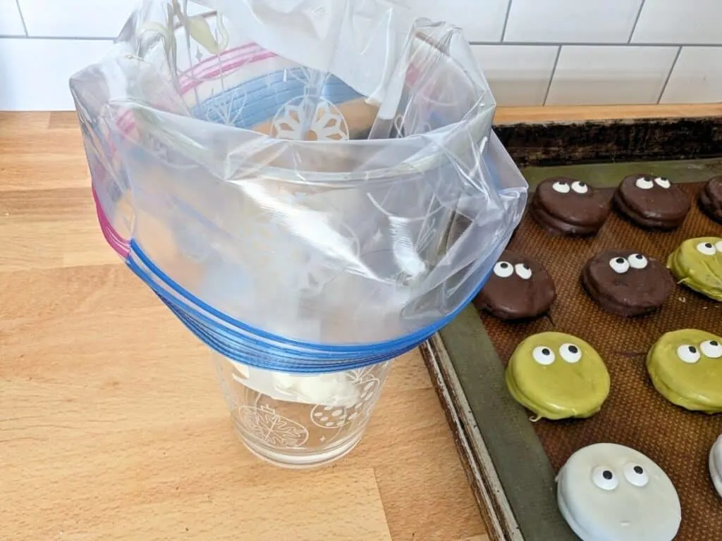 Image shows a Bag upside down in a glass waiting for chocolate.