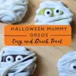 Image shows a Close up overhead of Halloween Oreo mummy cookies with text halloween mummy oreos easy and quick treat.