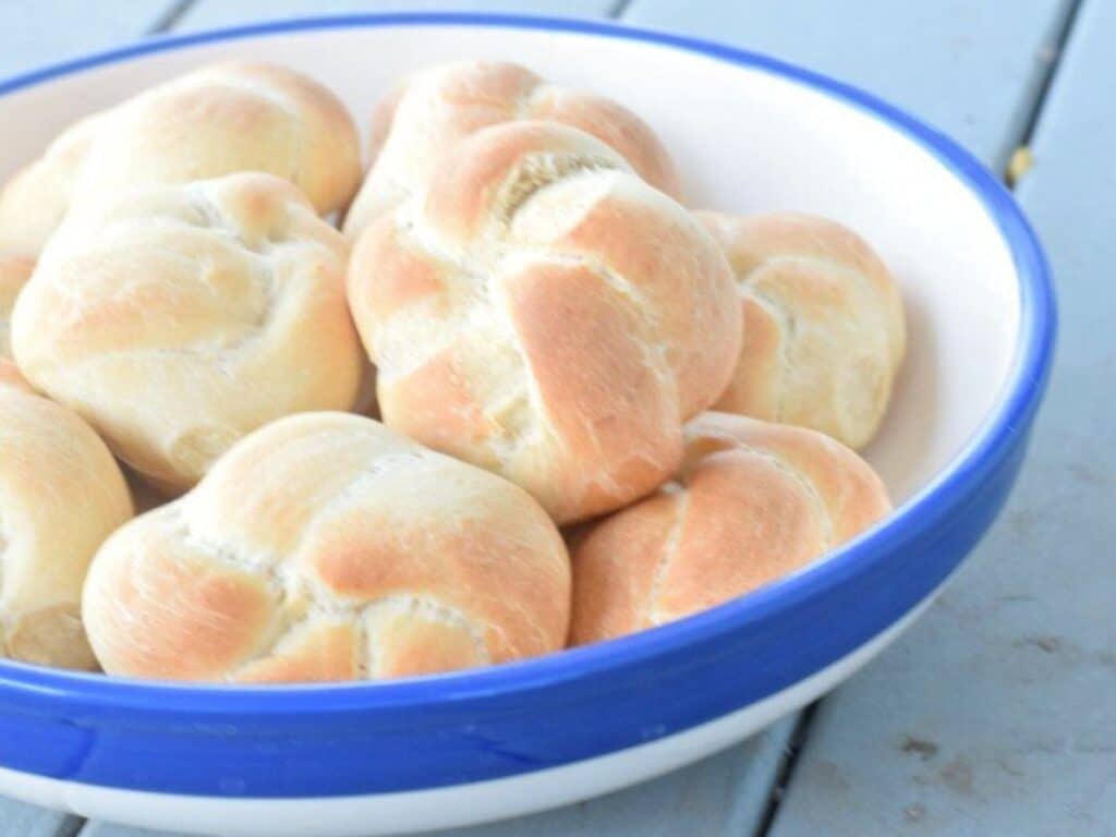 Image shows basket of yummy homemade dinner rolls.