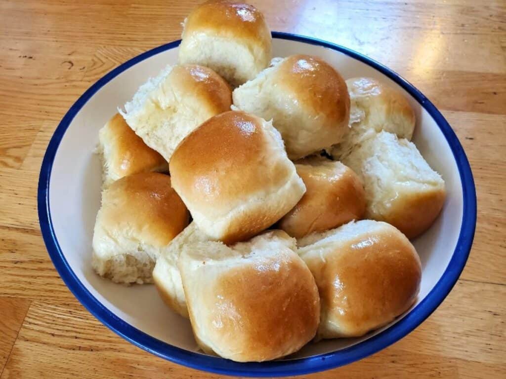 Image shows bowl of delicious homemade dinner rolls.