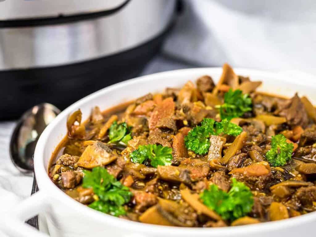 Image shows irresistible beef stew goulash instant pot.