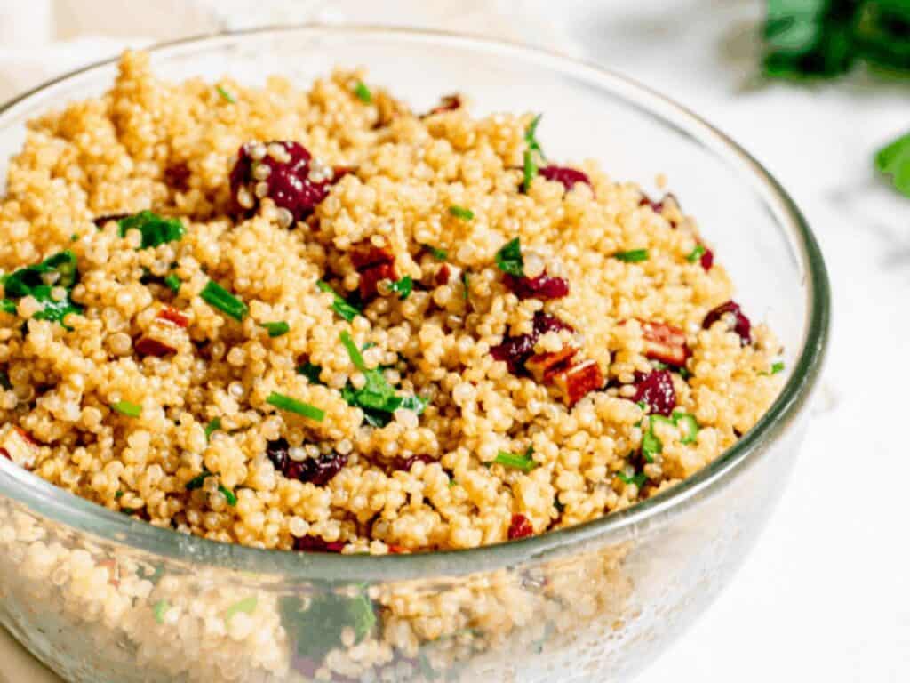 Image shows irresistible vegan cranberry quinoa salad.