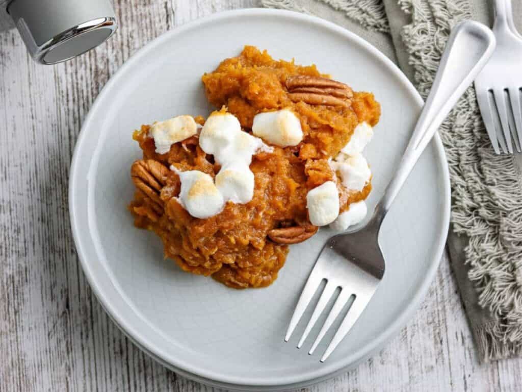 Image shows yummy crockpot sweet potato casserole.