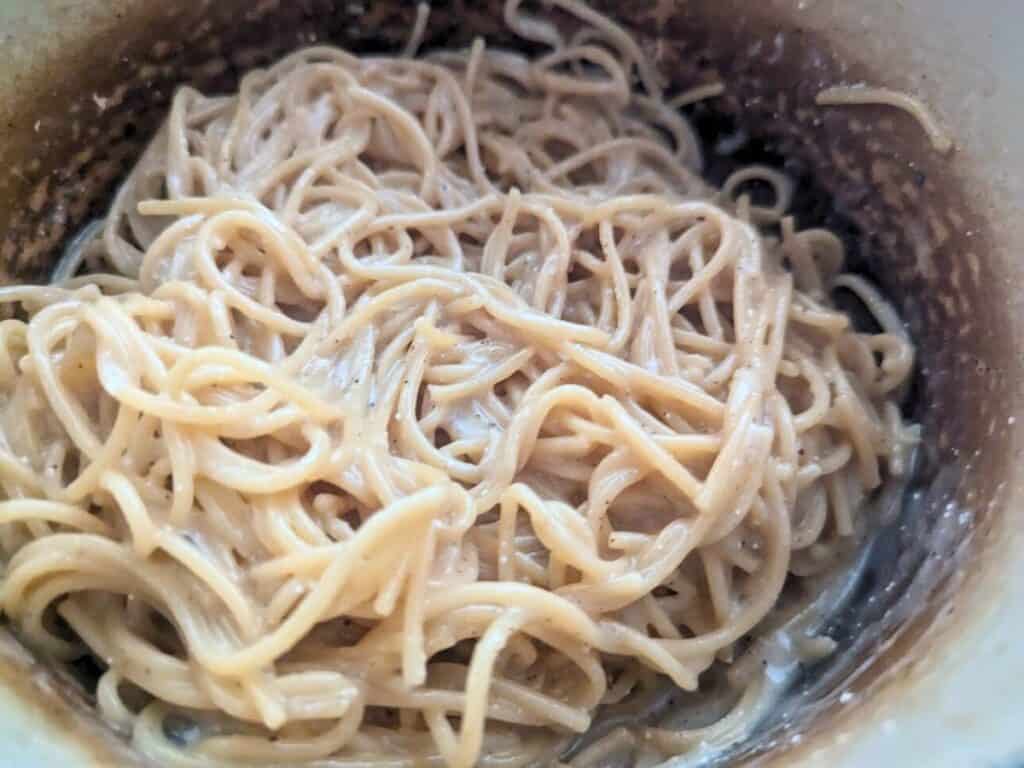 Image shows cooked lemon butter pasta in the pot.